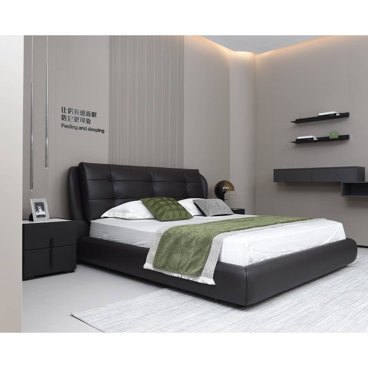 Side view of the black leather bed with bedside table
