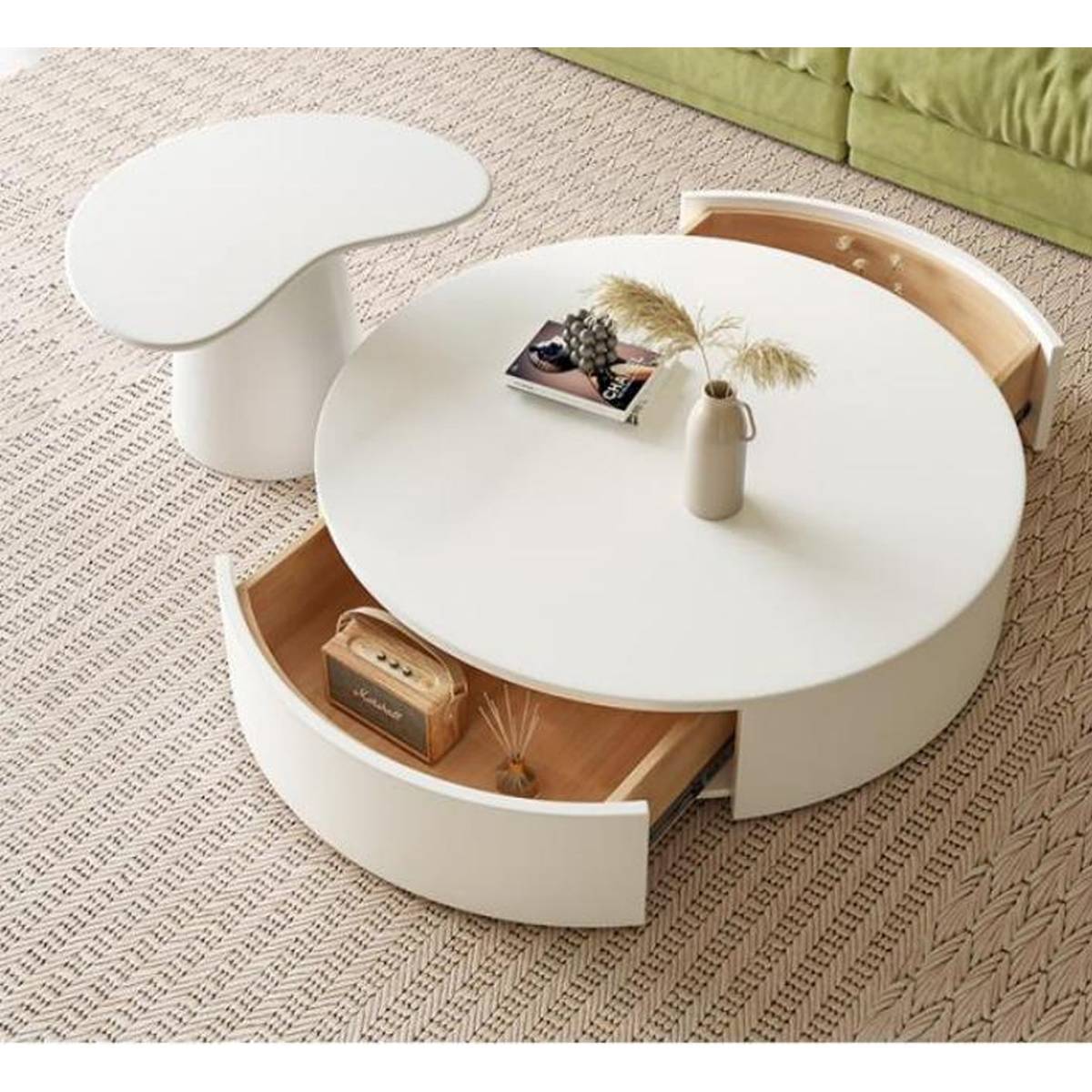 Close-up of the coffee table showing open drawers with solid wood interior and decorative items