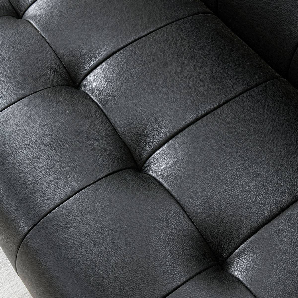 Close-up texture shot of the black leather upholstery