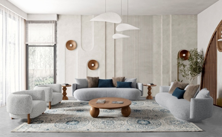 Wide shot of the living room setup featuring the sofa, coffee table, and armchairs