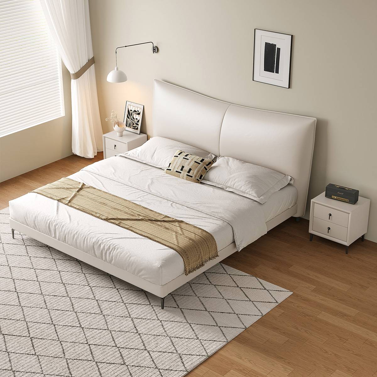 High angle view of the white upholstered bed with bedding