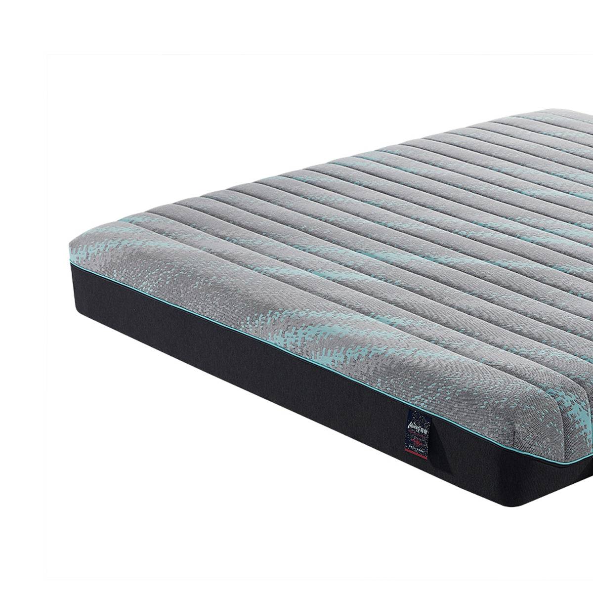 Side angle view showing the mattress profile and corner tag