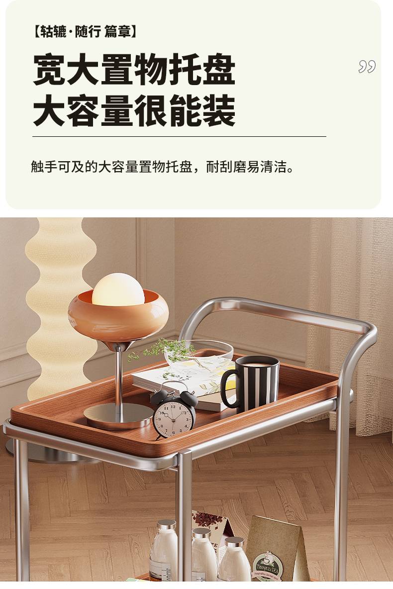 Top view of the spacious wooden tray holding a lamp, clock, and books.
