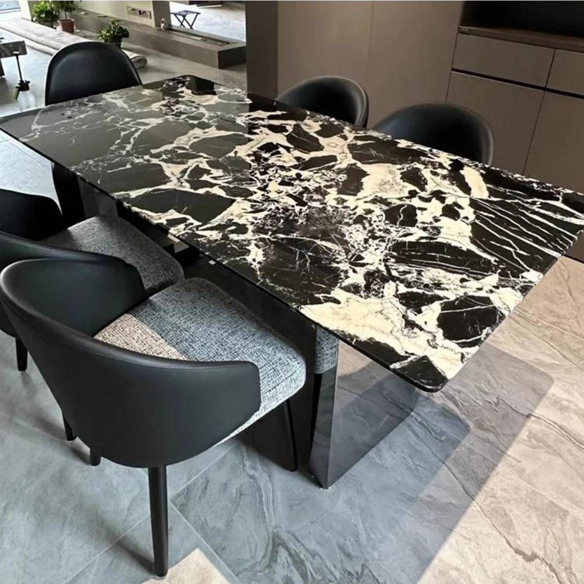Close-up view of the Bulgari Black marble tabletop texture and Fendi base