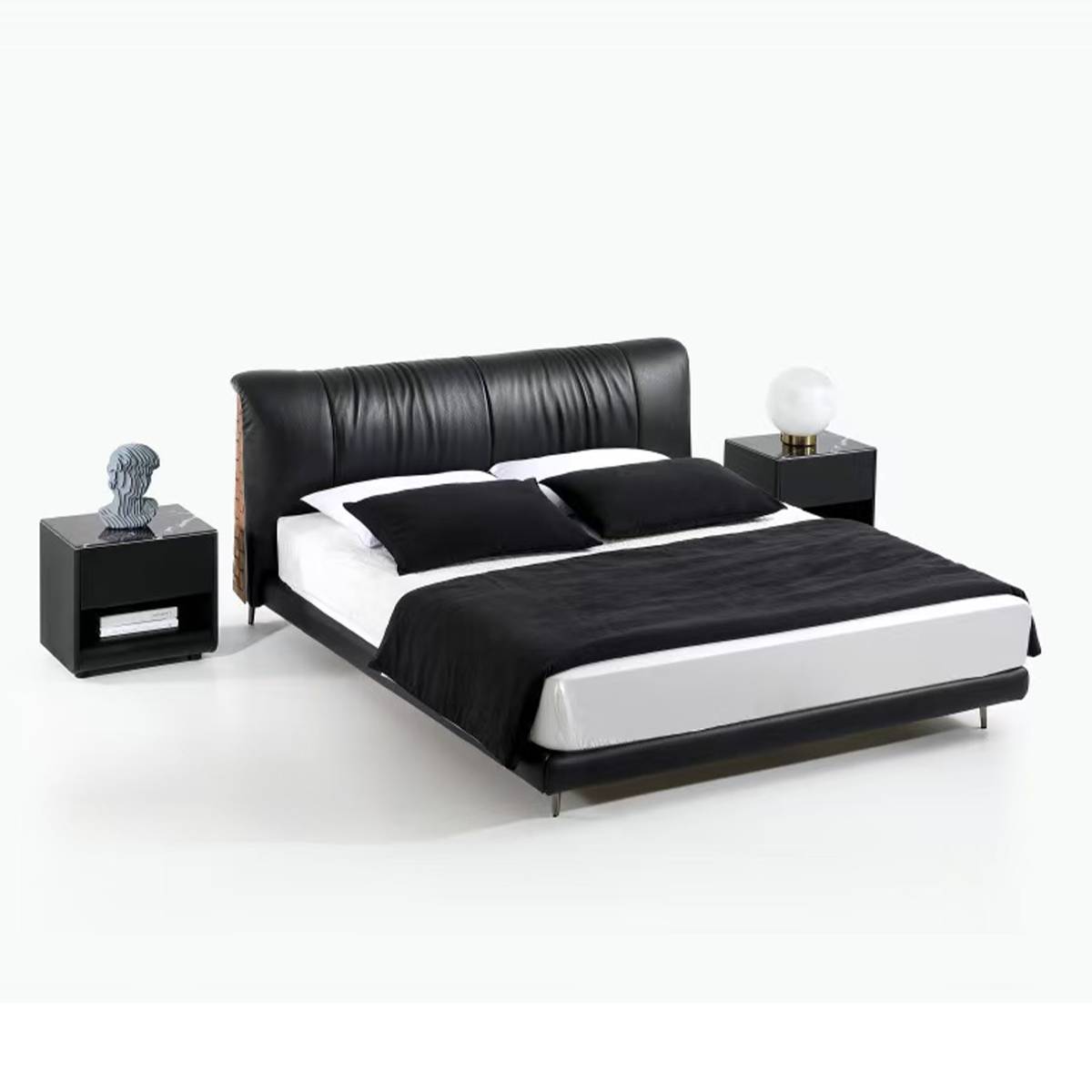 Front view of the black leather bed with white bedding and black throw