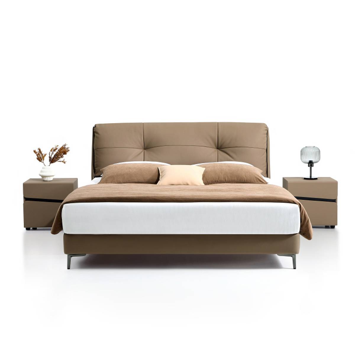 Front view of the brown leather bed showing the tufted headboard and bedding arrangement