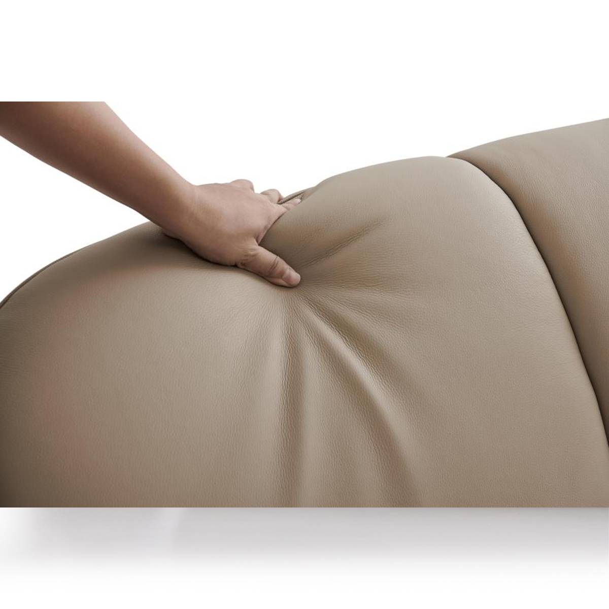 Close-up of a hand pressing into the beige genuine leather upholstery of the bed to demonstrate softness and texture.