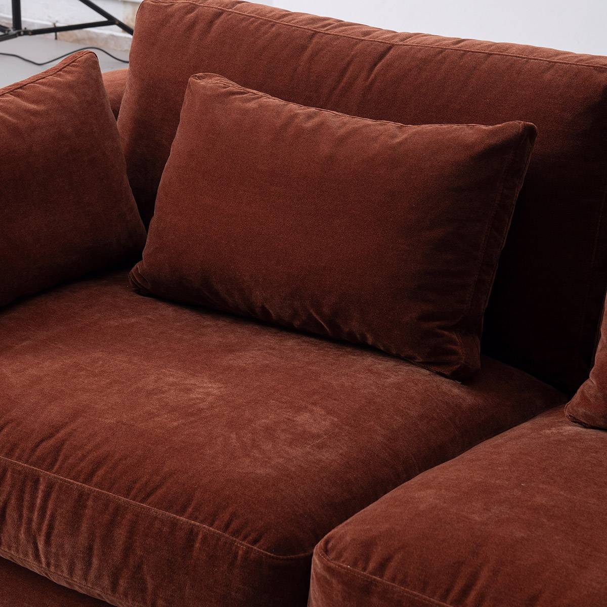 Close-up of the sofa seat cushions and back pillows
