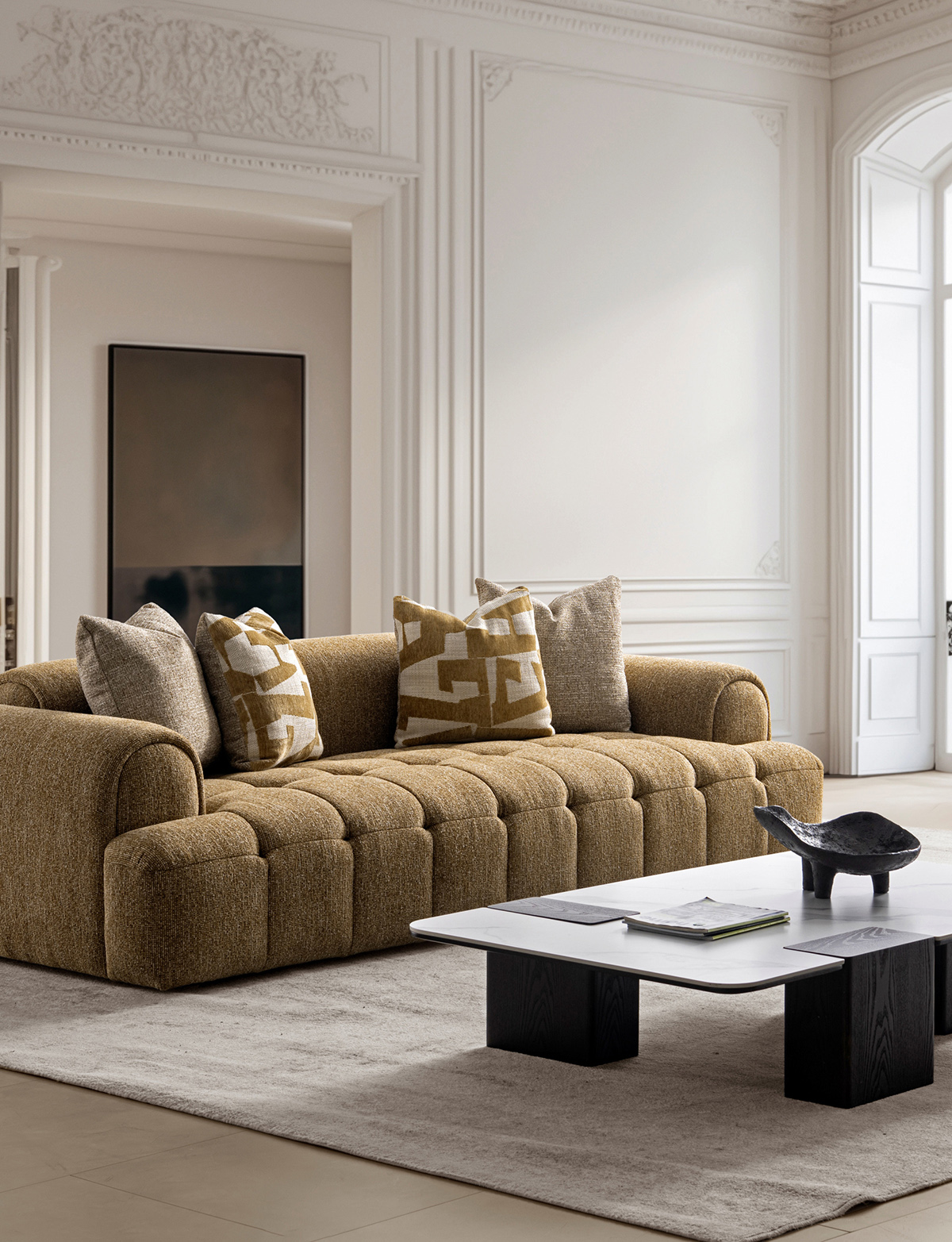 Side angle view of the beige puff sofa showing the deep seat and cushions