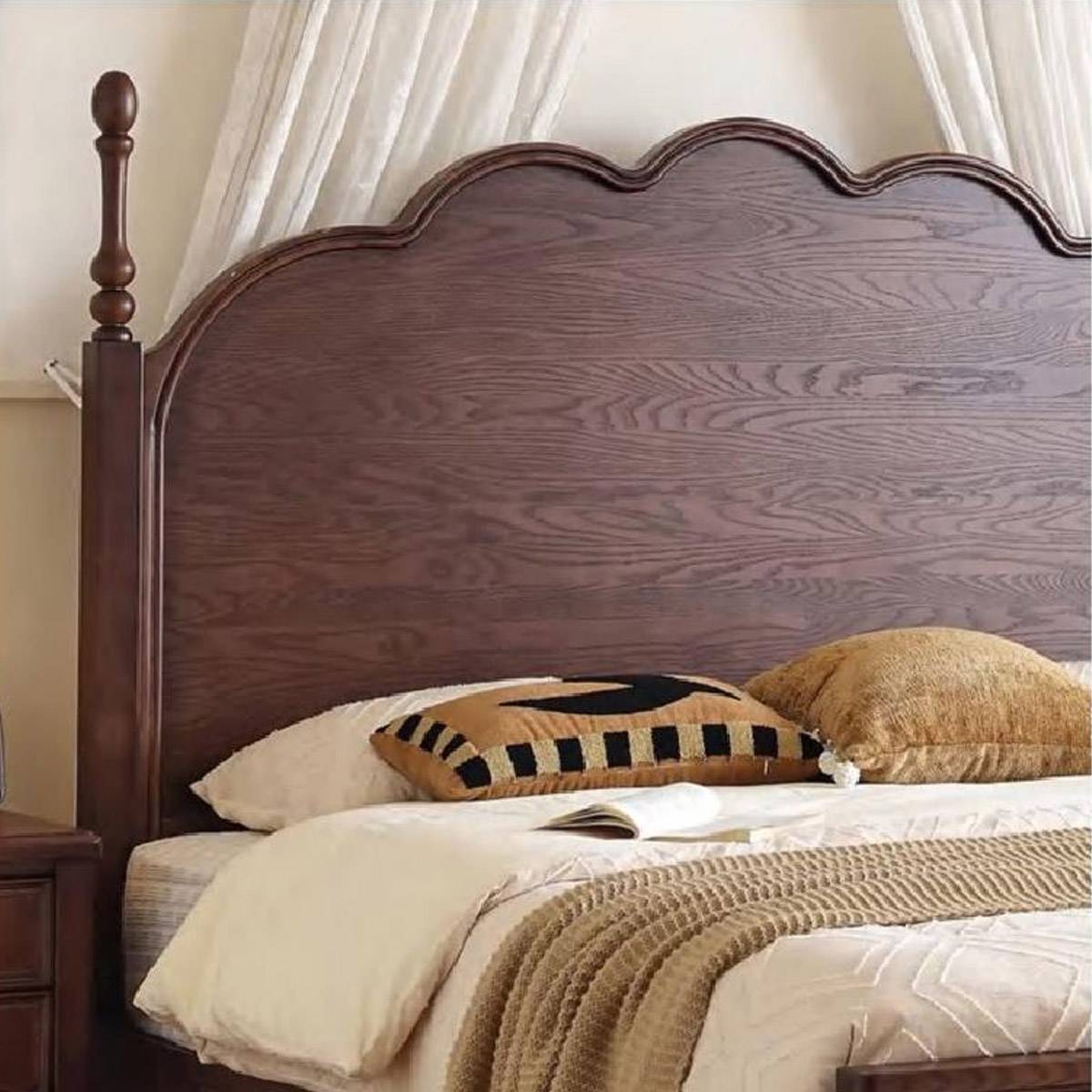 Close-up detail of the wooden headboard texture and pillows