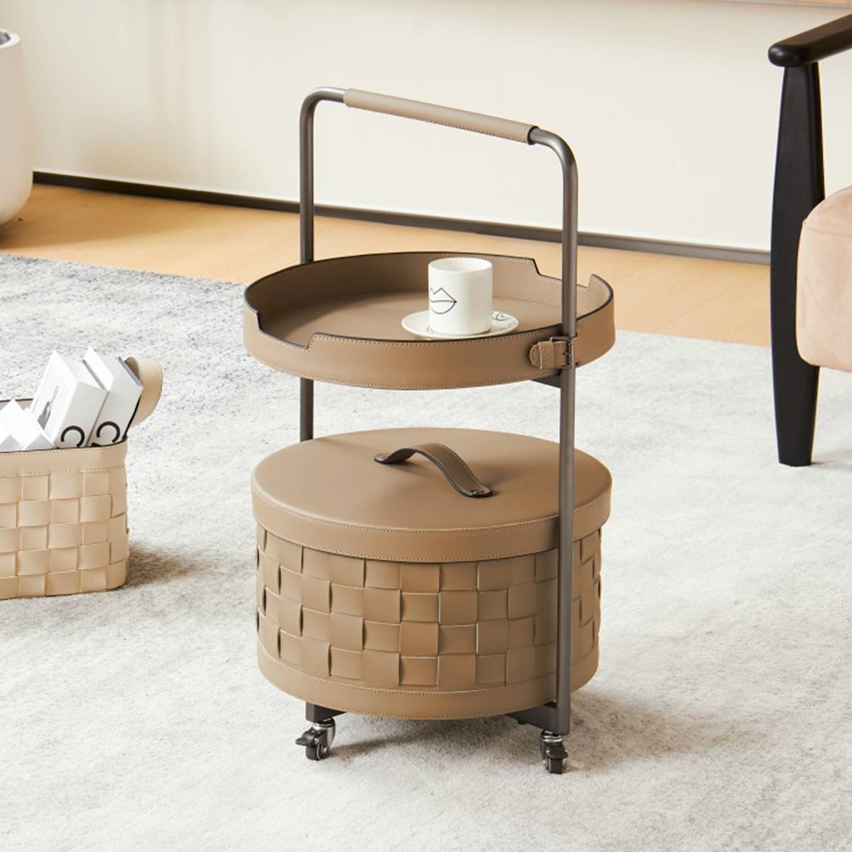 Side angle view of the round side table showing the wheels and woven storage basket