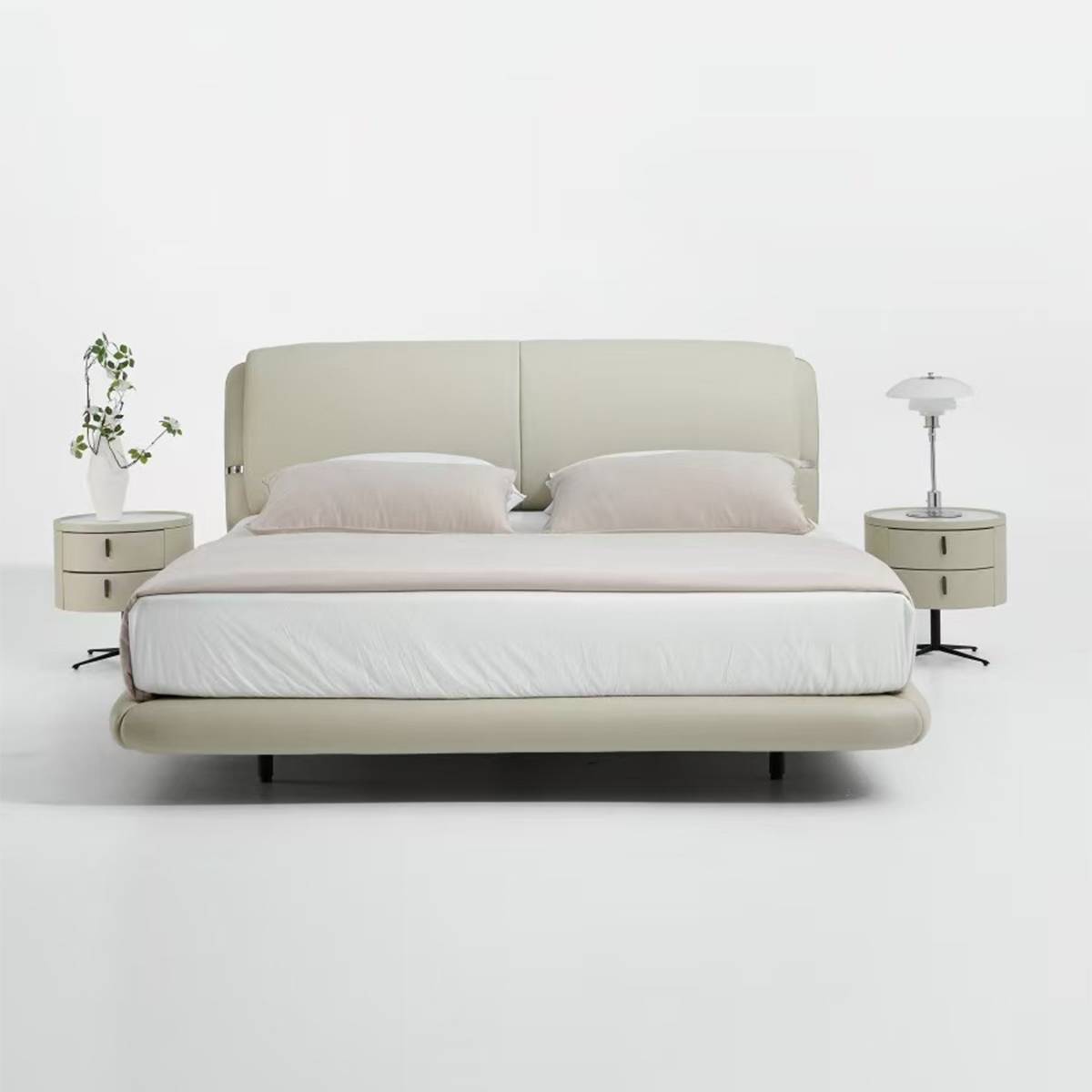 Front view of the beige upholstered bed with matching bedside tables