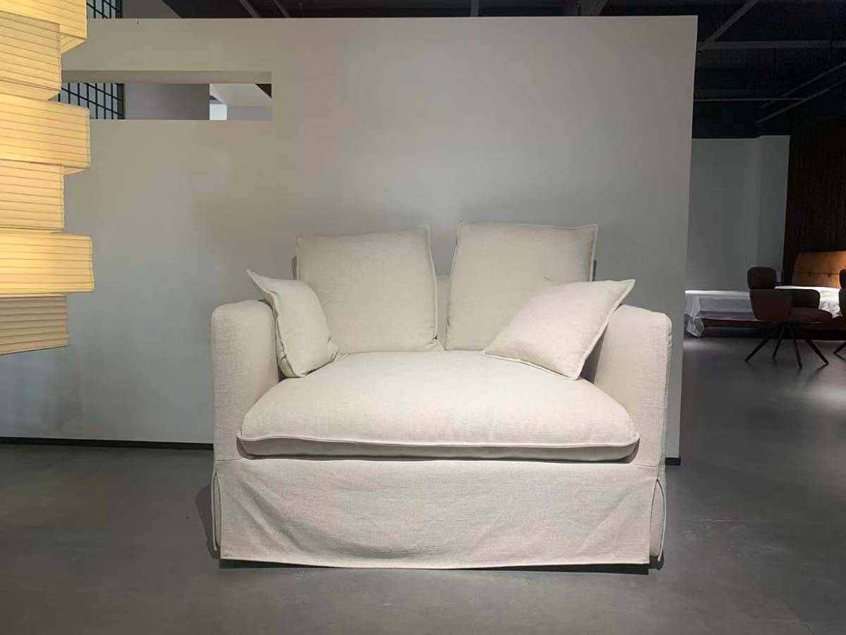 Front view of the sofa showing the fabric texture and cushion arrangement.