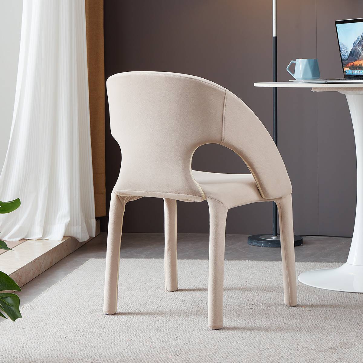 Rear view of peach colored modern lounge chair