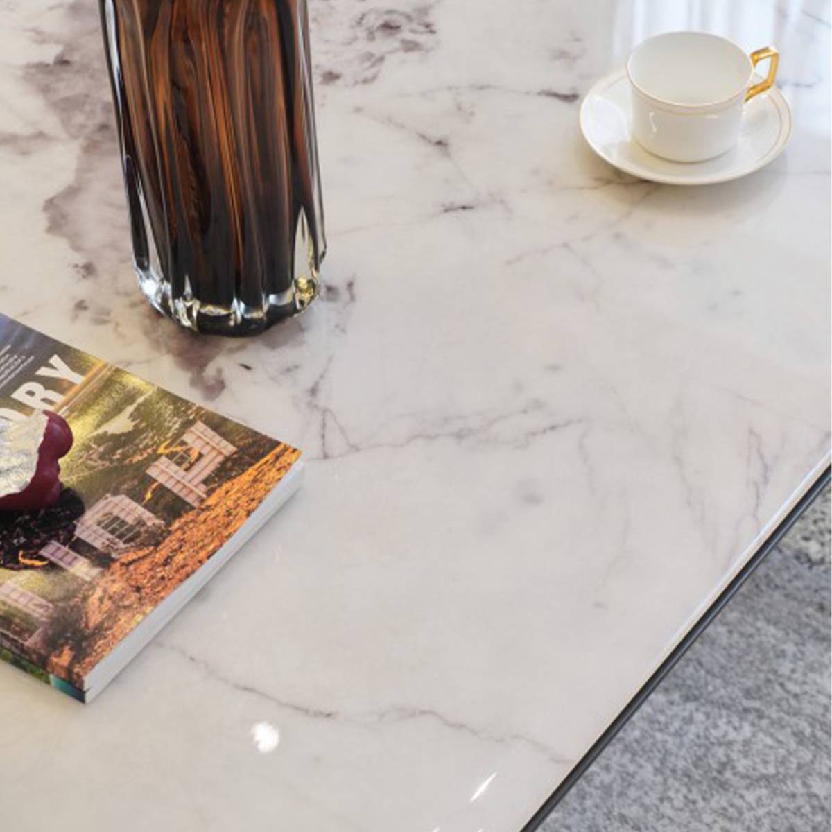 Close-up detail of the microcrystalline stone tabletop showing the Pandora purple pattern and texture
