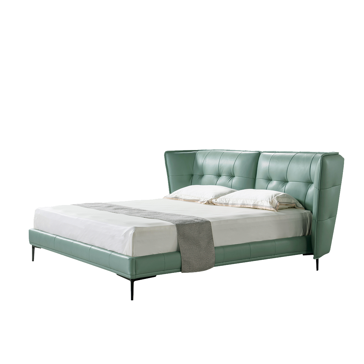Side angle view of the green leather bed showing the headboard profile