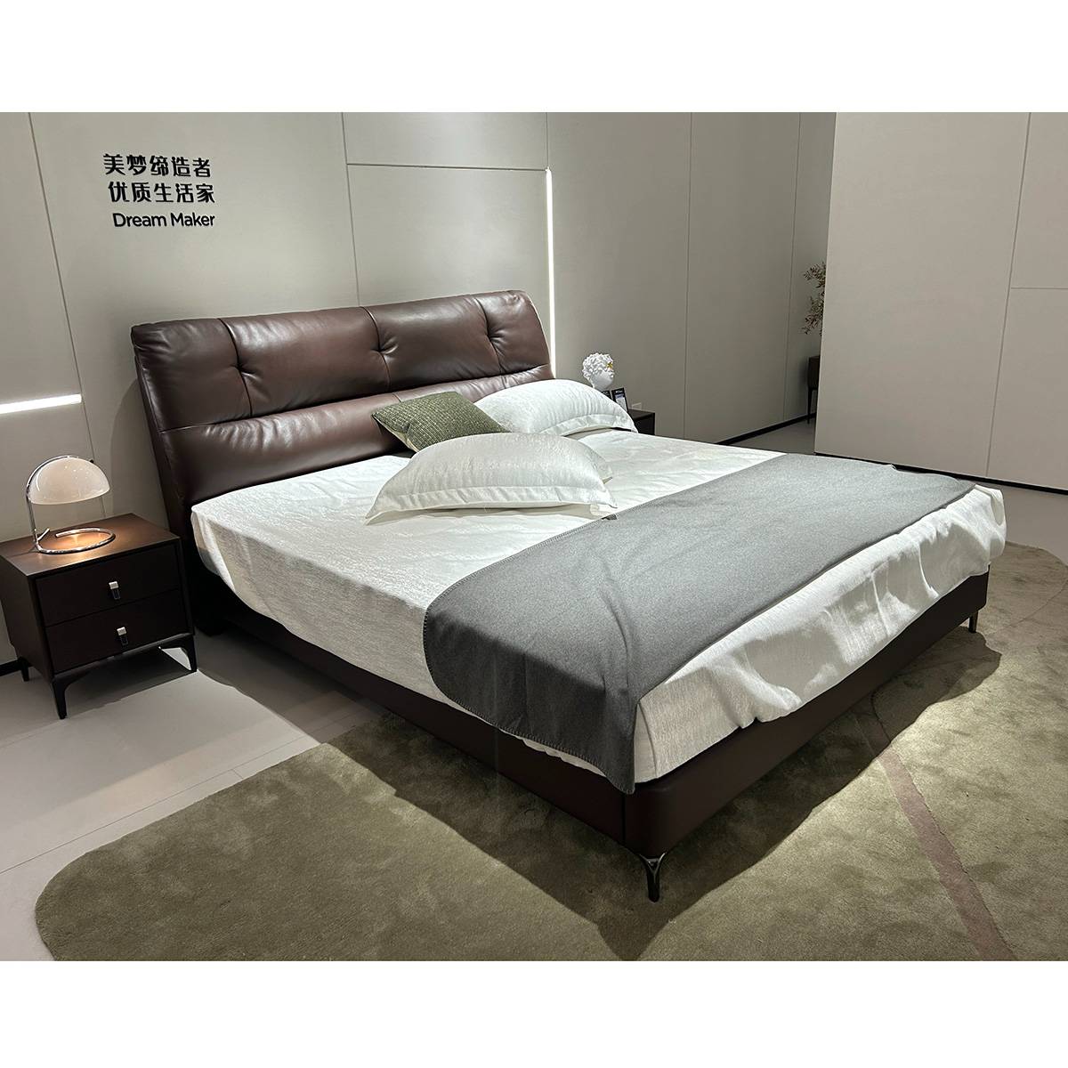 Side view of brown leather bed in showroom setting