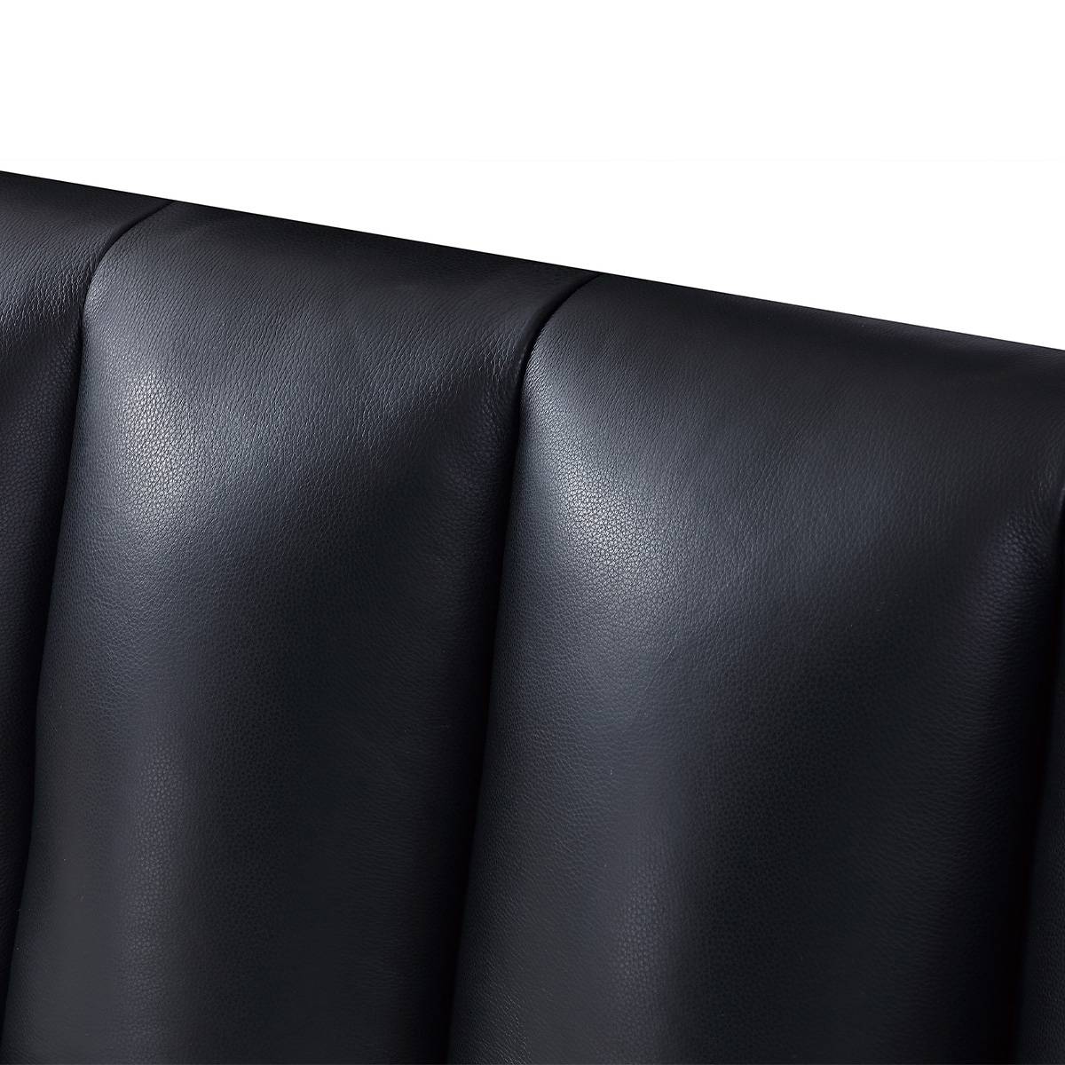 Close-up detail of the black top-grain leather upholstery showing texture and stitching