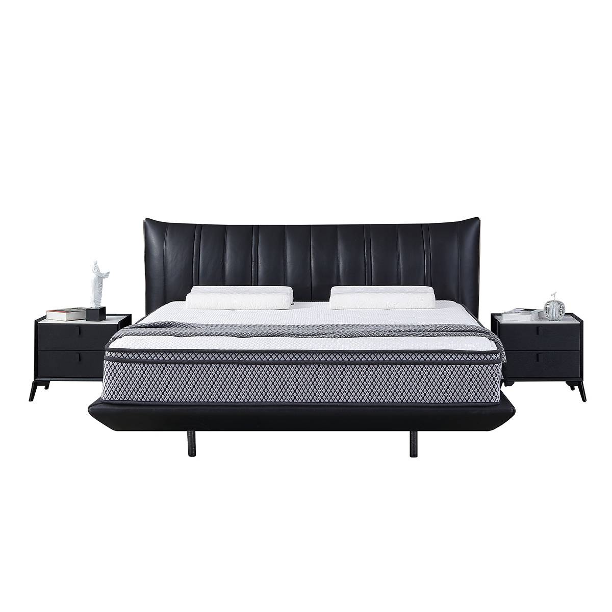 Front view of the black leather bed with matching nightstands