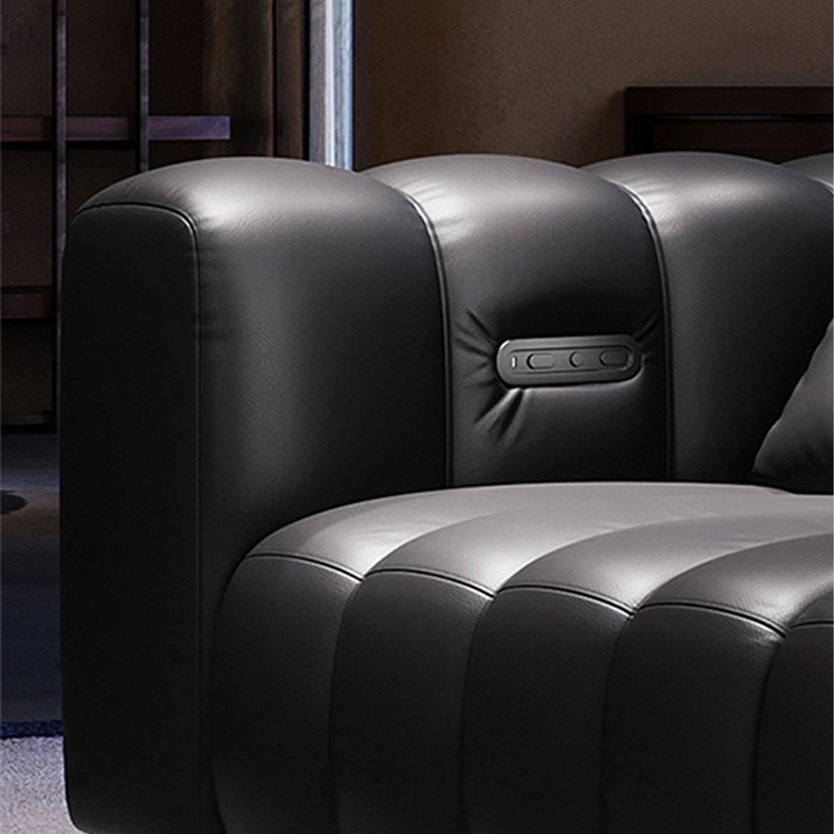 Detail shot of electric control buttons on the sofa armrest