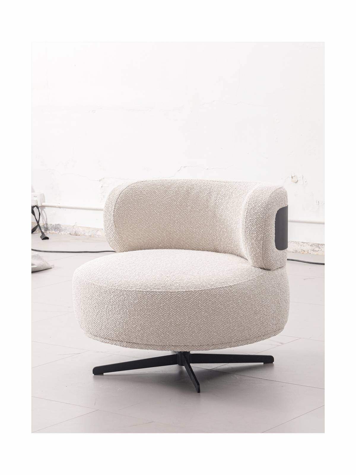 Lifestyle shot of beige swivel lounge chair in a room setting
