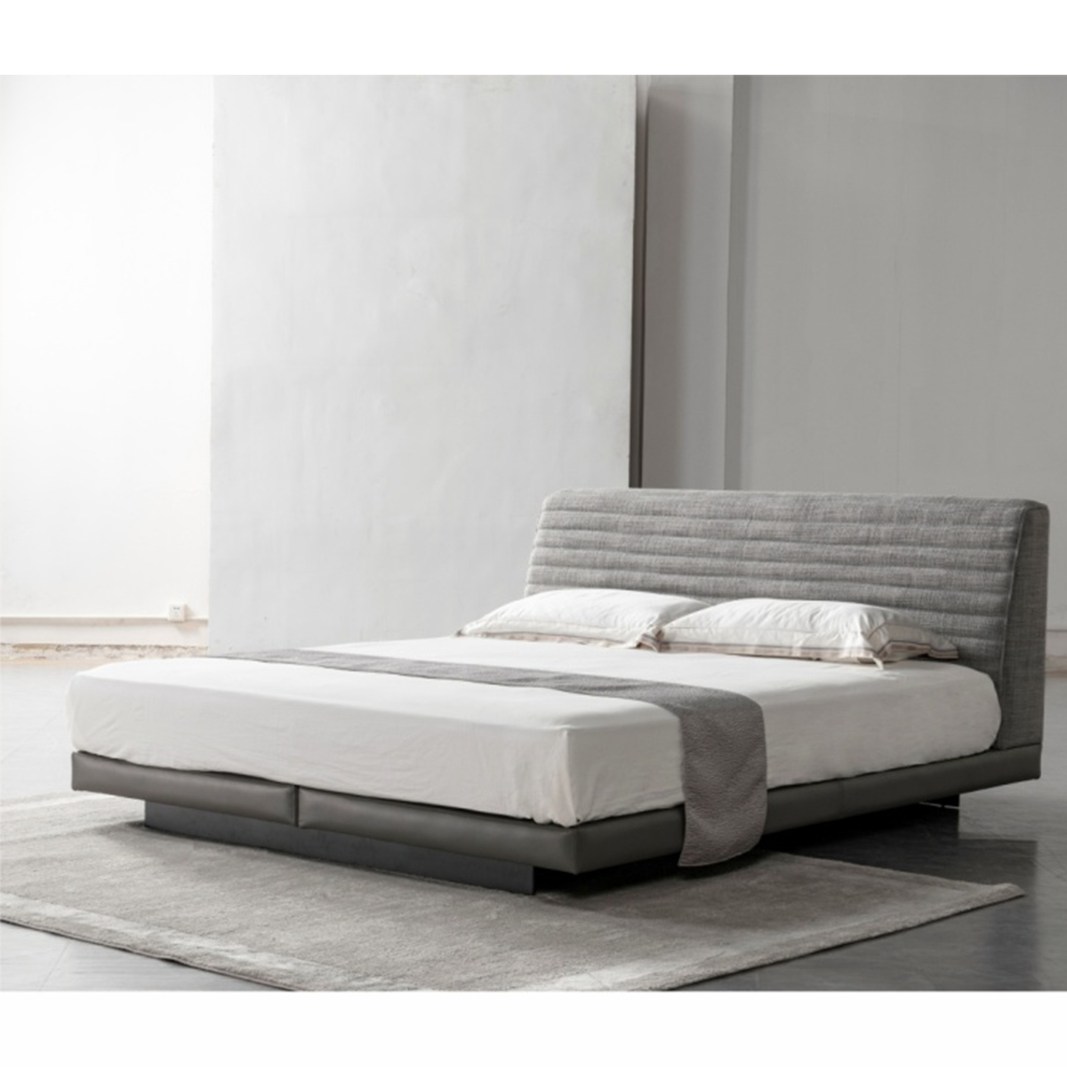 Angled view of the Roger Bed on a rug
