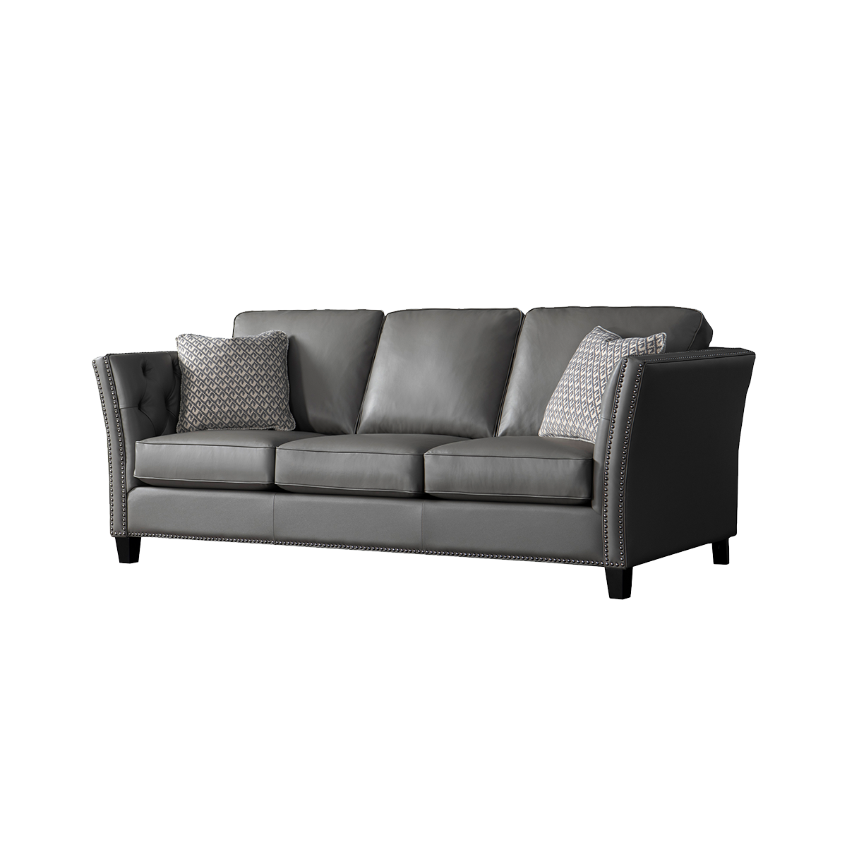 Angled view of the grey leather sofa showing the tufted armrest and nailhead trim
