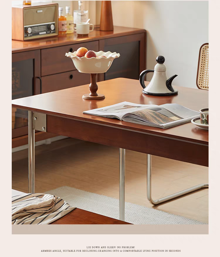 Side view of the dining table showing the stainless steel legs and wooden top