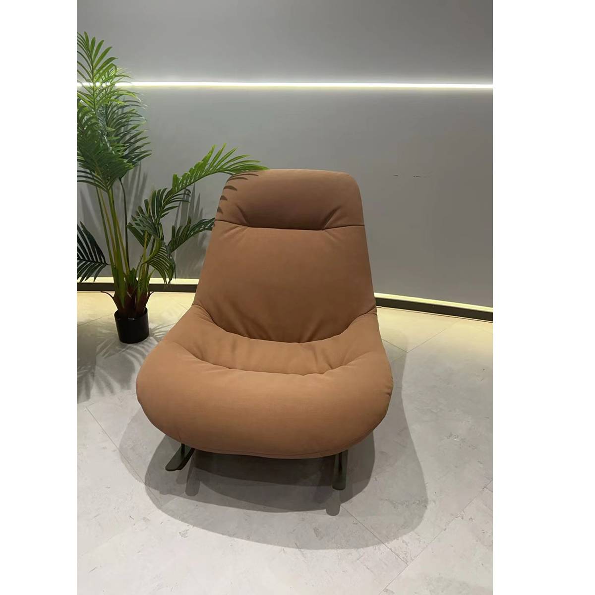 Front view of the empty brown rocking lounge chair