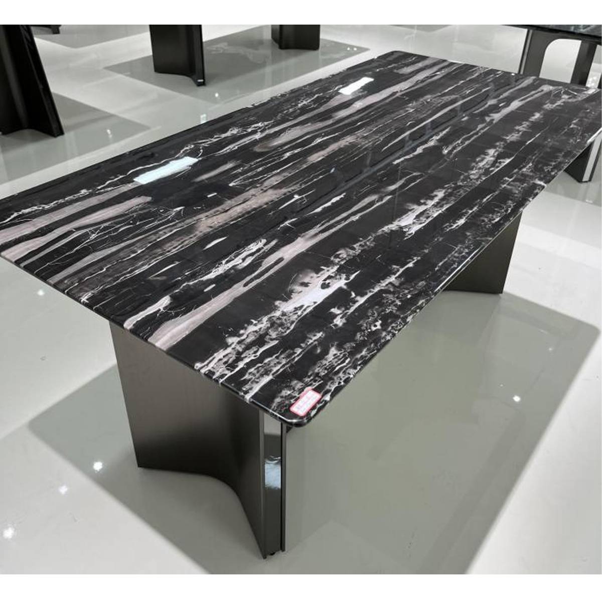 Close-up angle of the marble tabletop showing the stone grain and edge detail