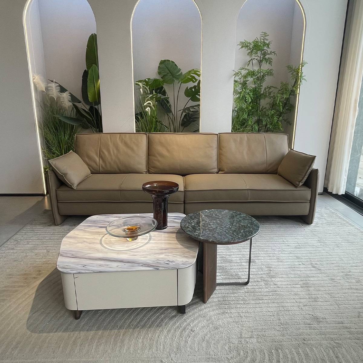 Front view of the leather sofa with marble coffee tables