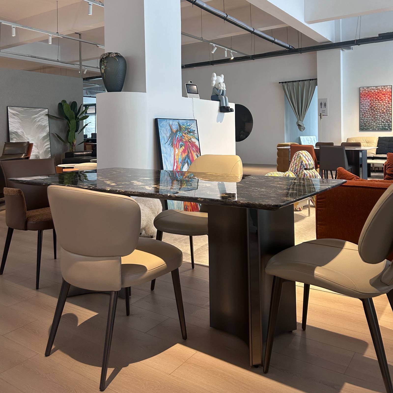 Wide angle view of the dining table in a furniture showroom