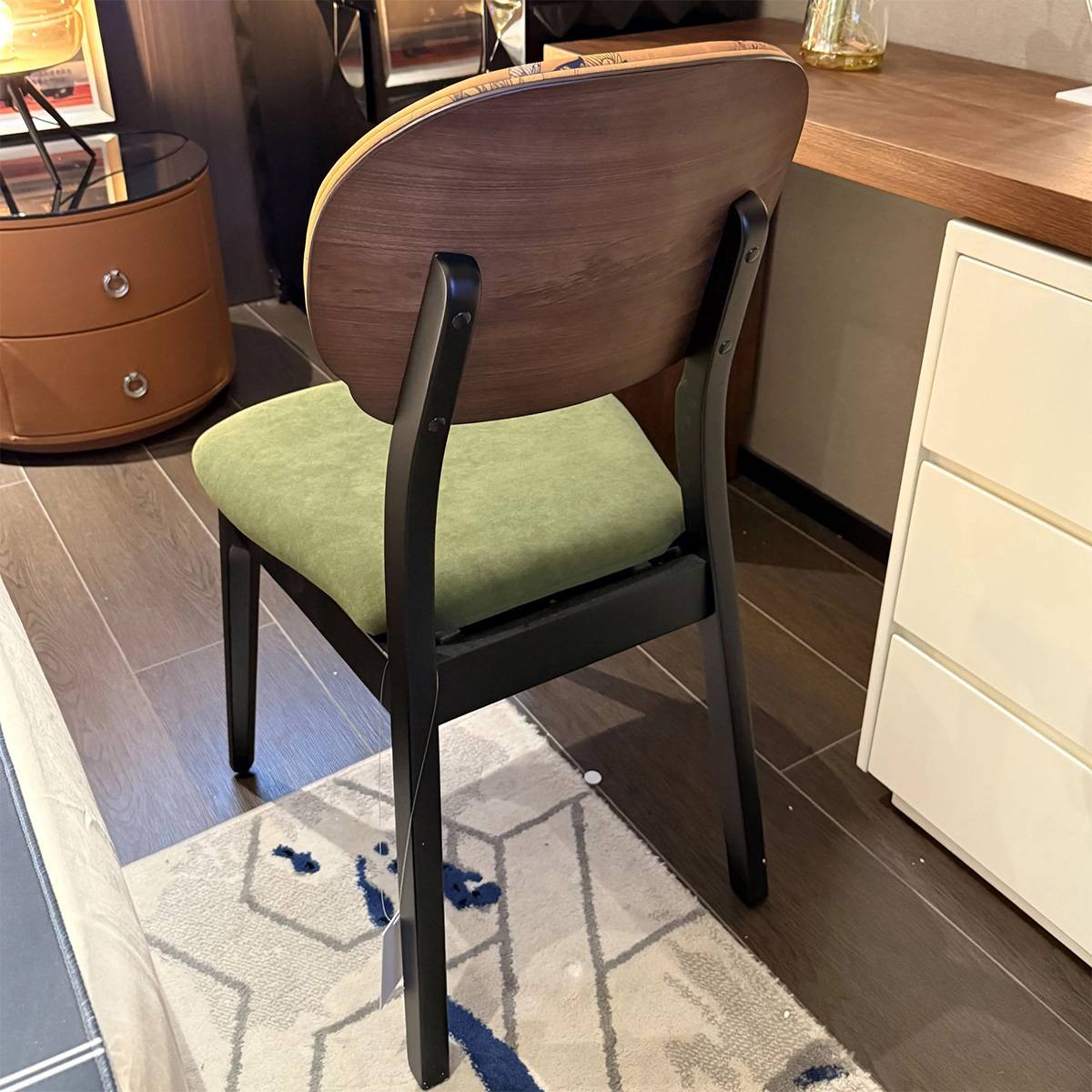 Rear view of dining chair showing oak backrest and frame structure