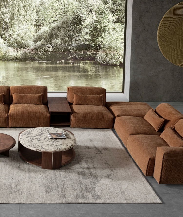 Modular sofa arrangement in a living room with a view of a lake