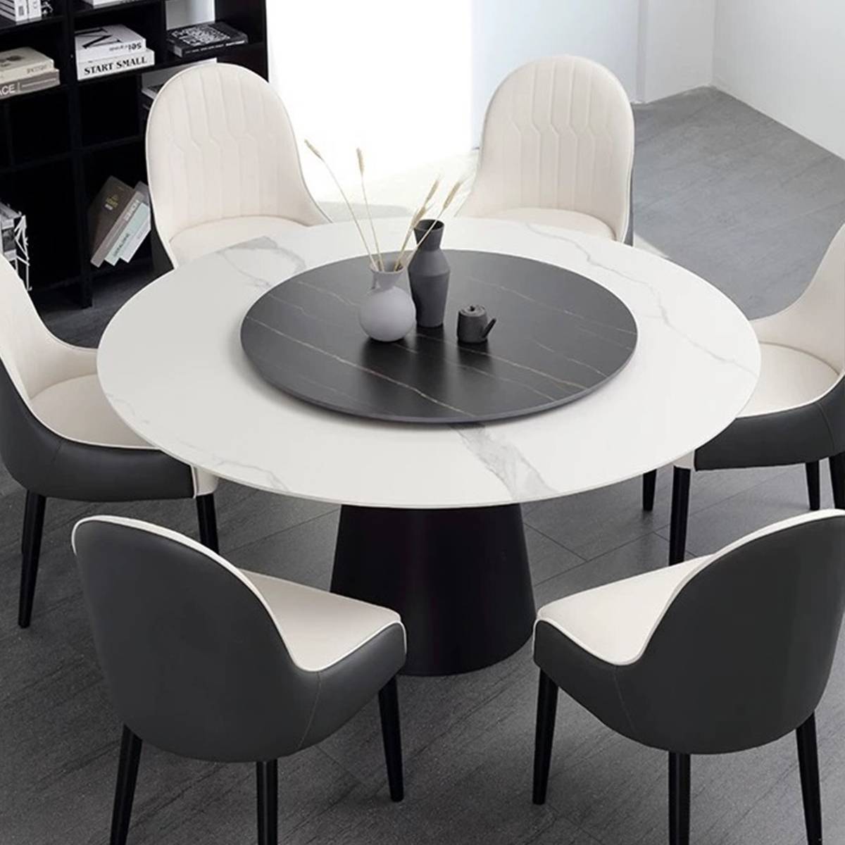 Top-down view of white sintered stone dining table with black rotating tray