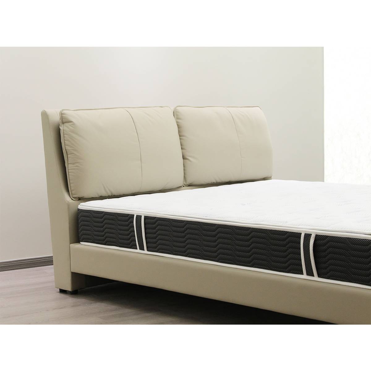 Close-up of bed headboard and mattress corner
