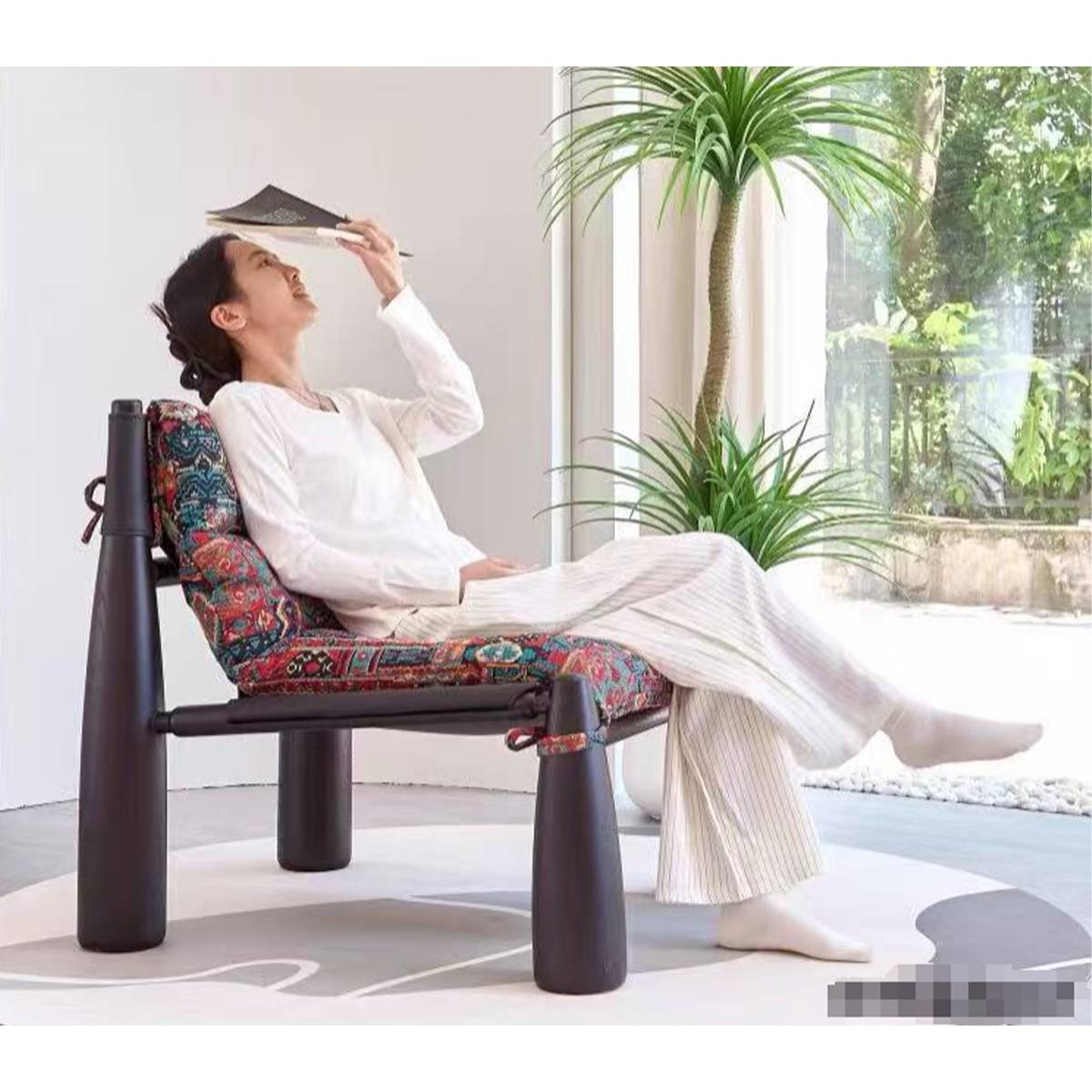 Side profile of person sitting on the lounge chair