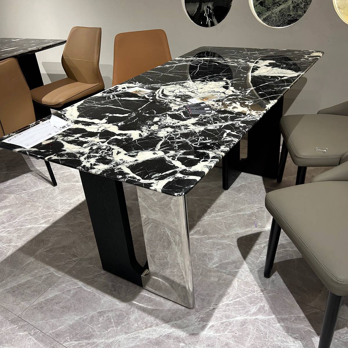 Bulgari Black natural stone dining table with black and white veining and stainless steel legs