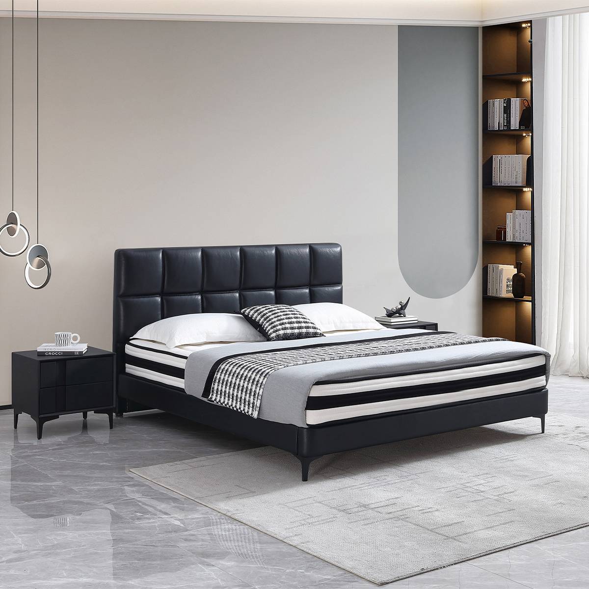Bedroom scene featuring the black leather bed and shelving unit