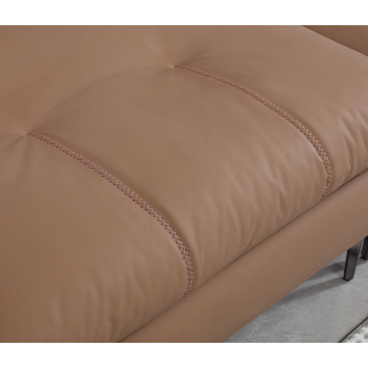 Detail shot of the sofa upholstery stitching and texture