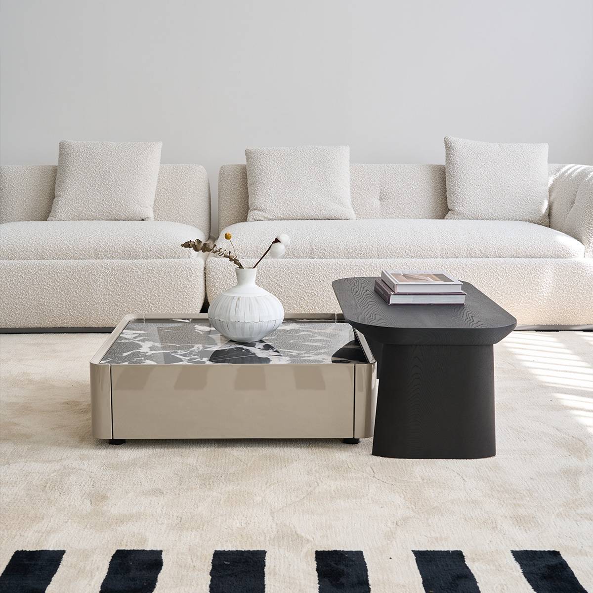 Wide shot of the coffee table set in a living room with a white sofa