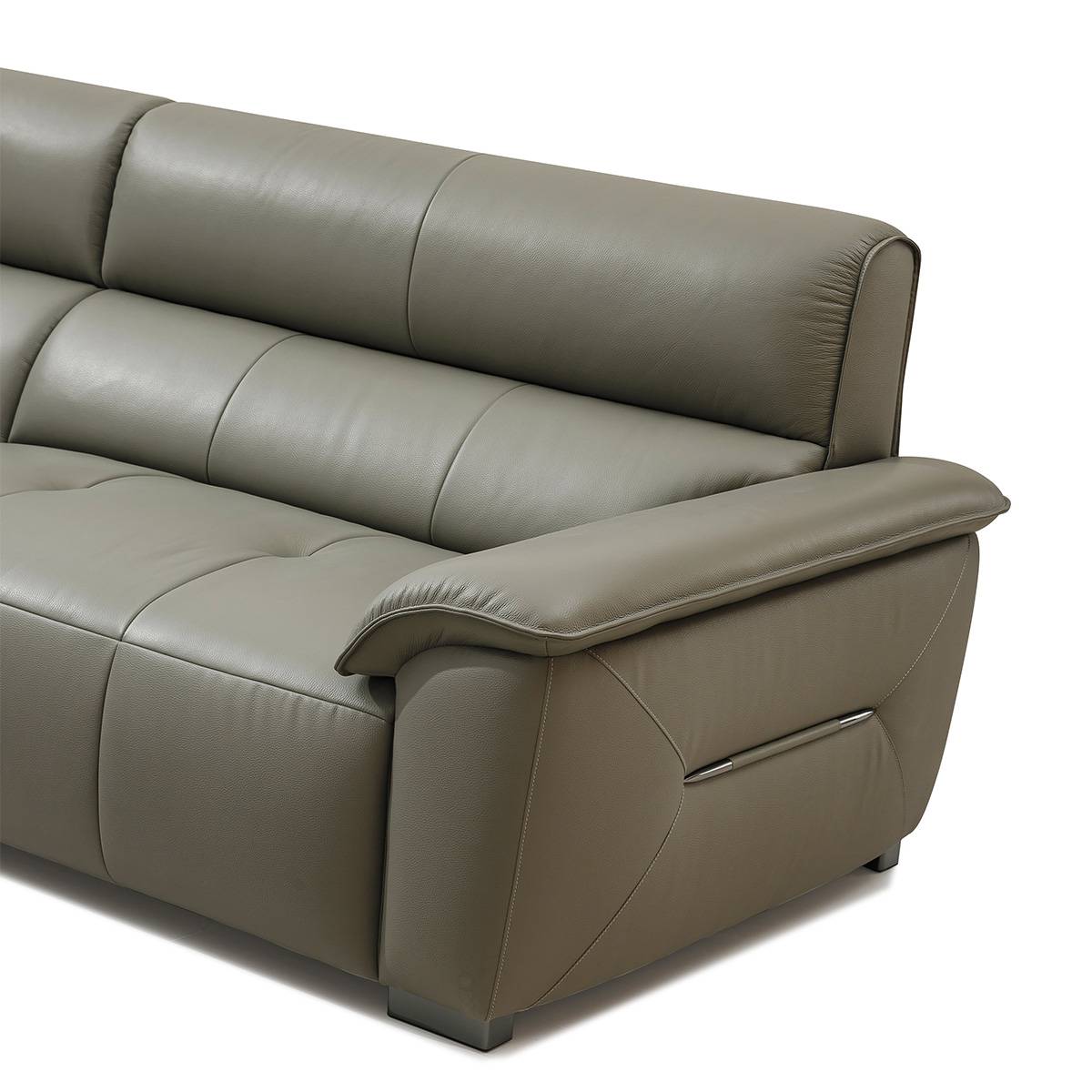 Side angle view of the sofa highlighting the tufted cushions and armrest design.