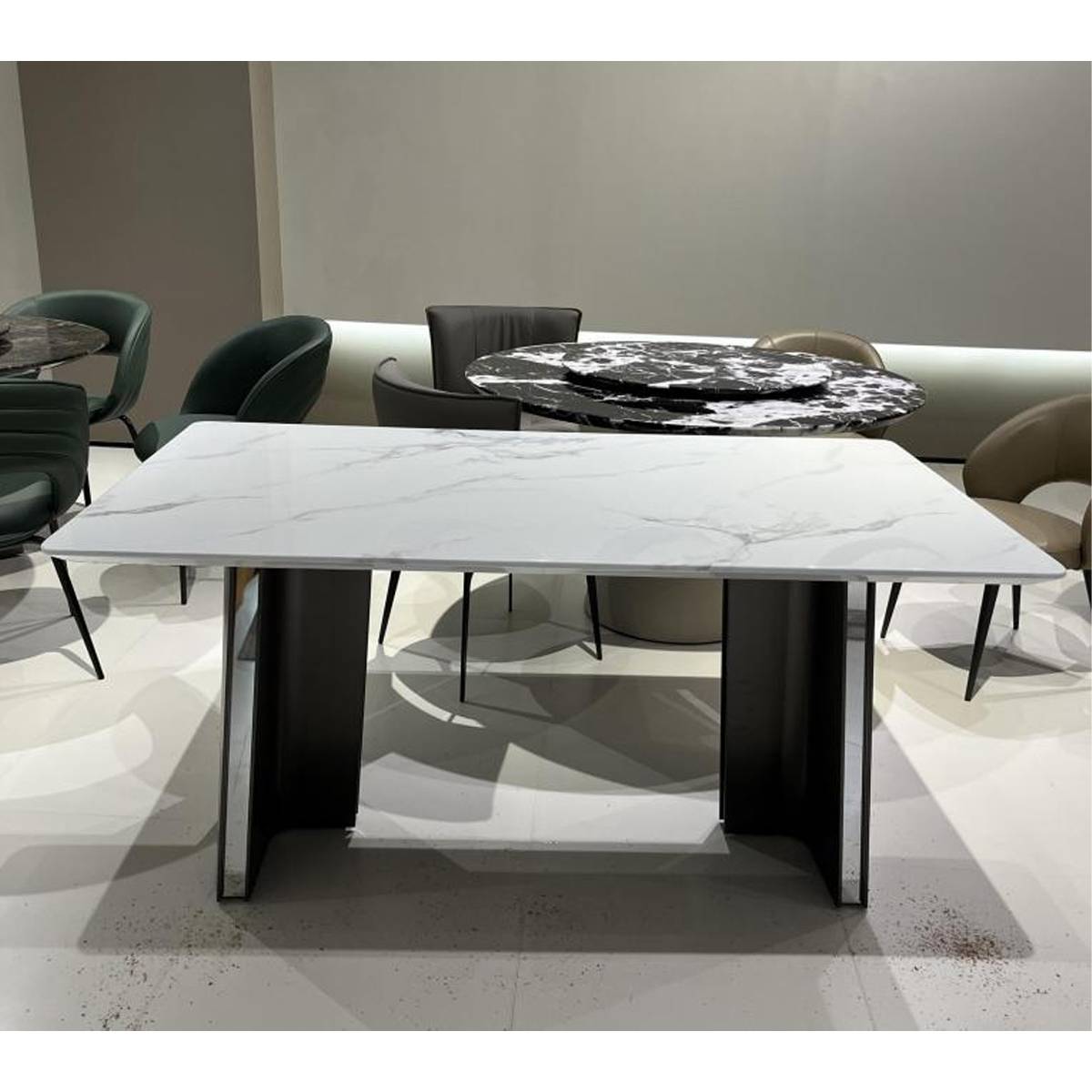 Front view of white marble dining table with stainless steel base