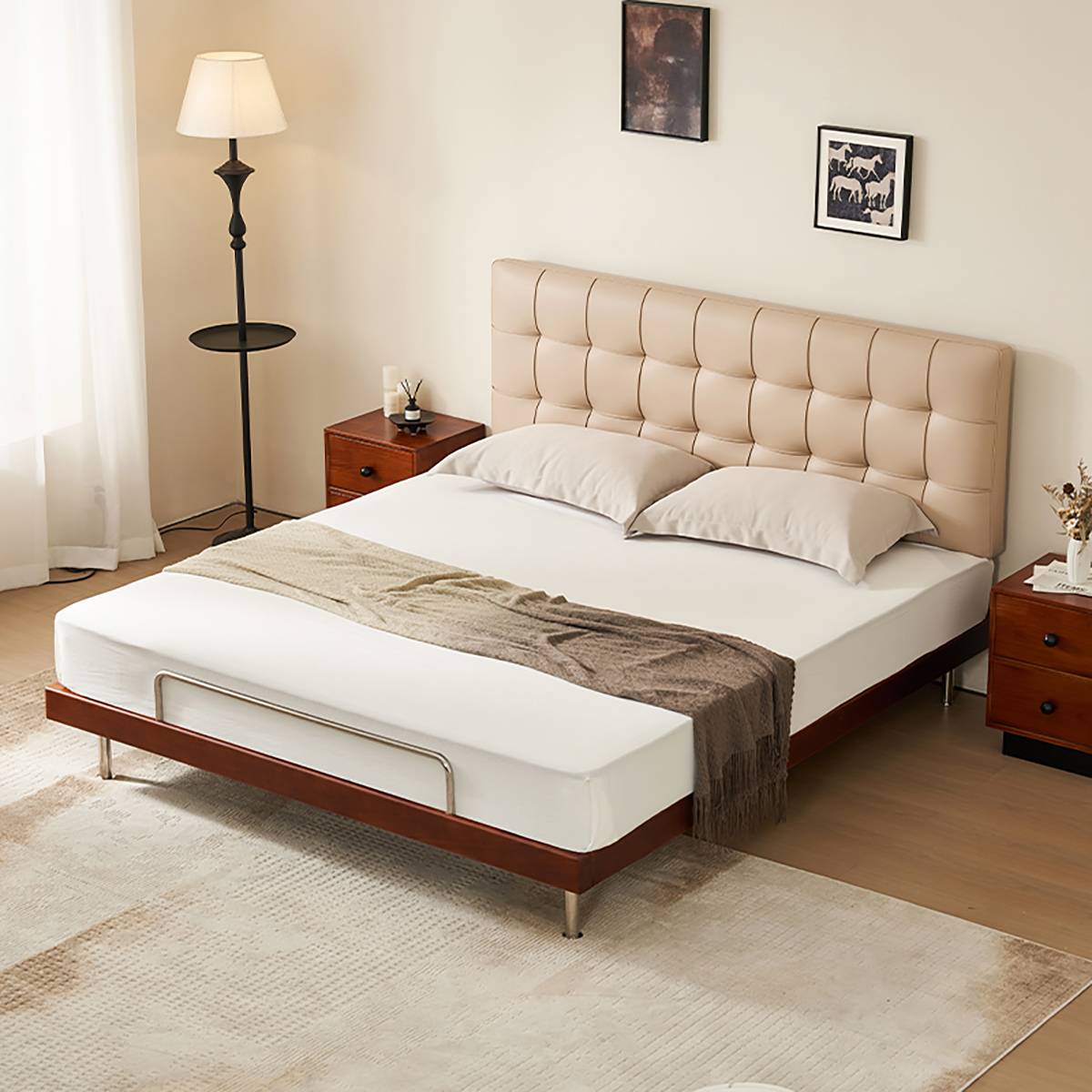 Angled view of the bed in a bedroom setting with beige headboard