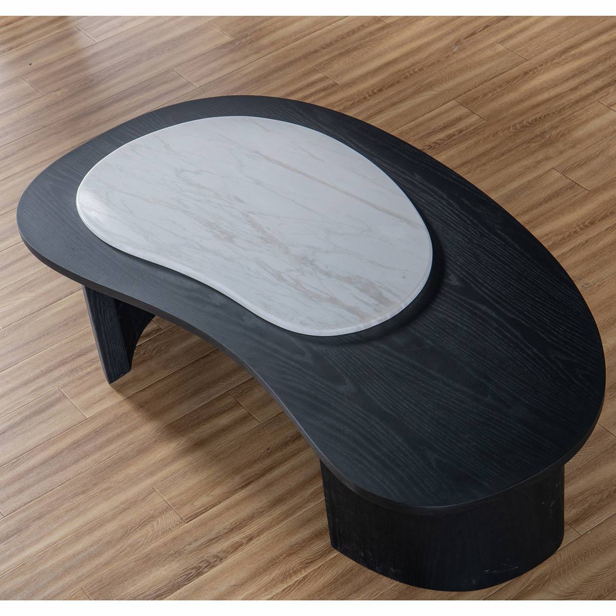 High angle view of the coffee table on a wooden floor showing the marble texture