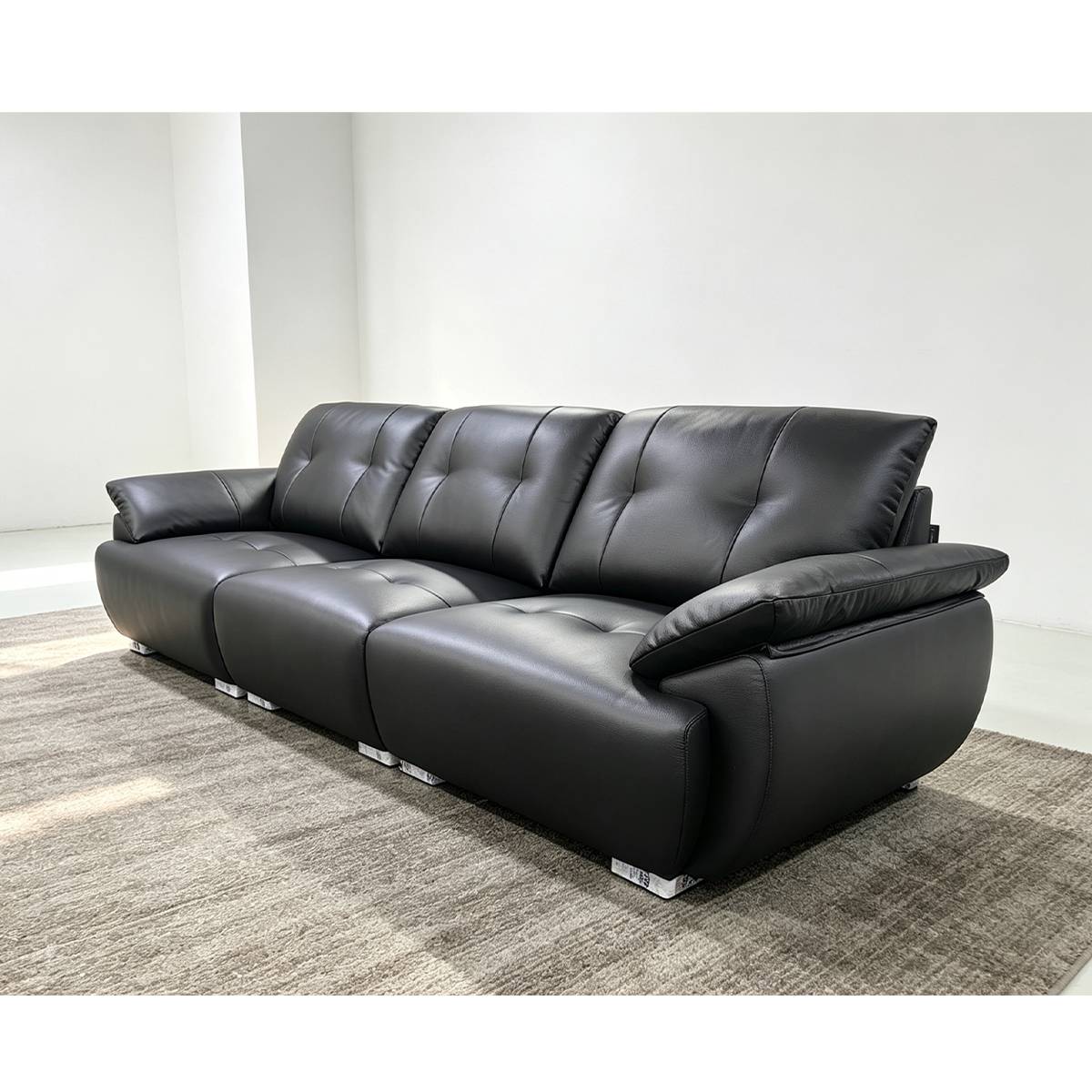 Side angle view of black eco-leather straight sofa