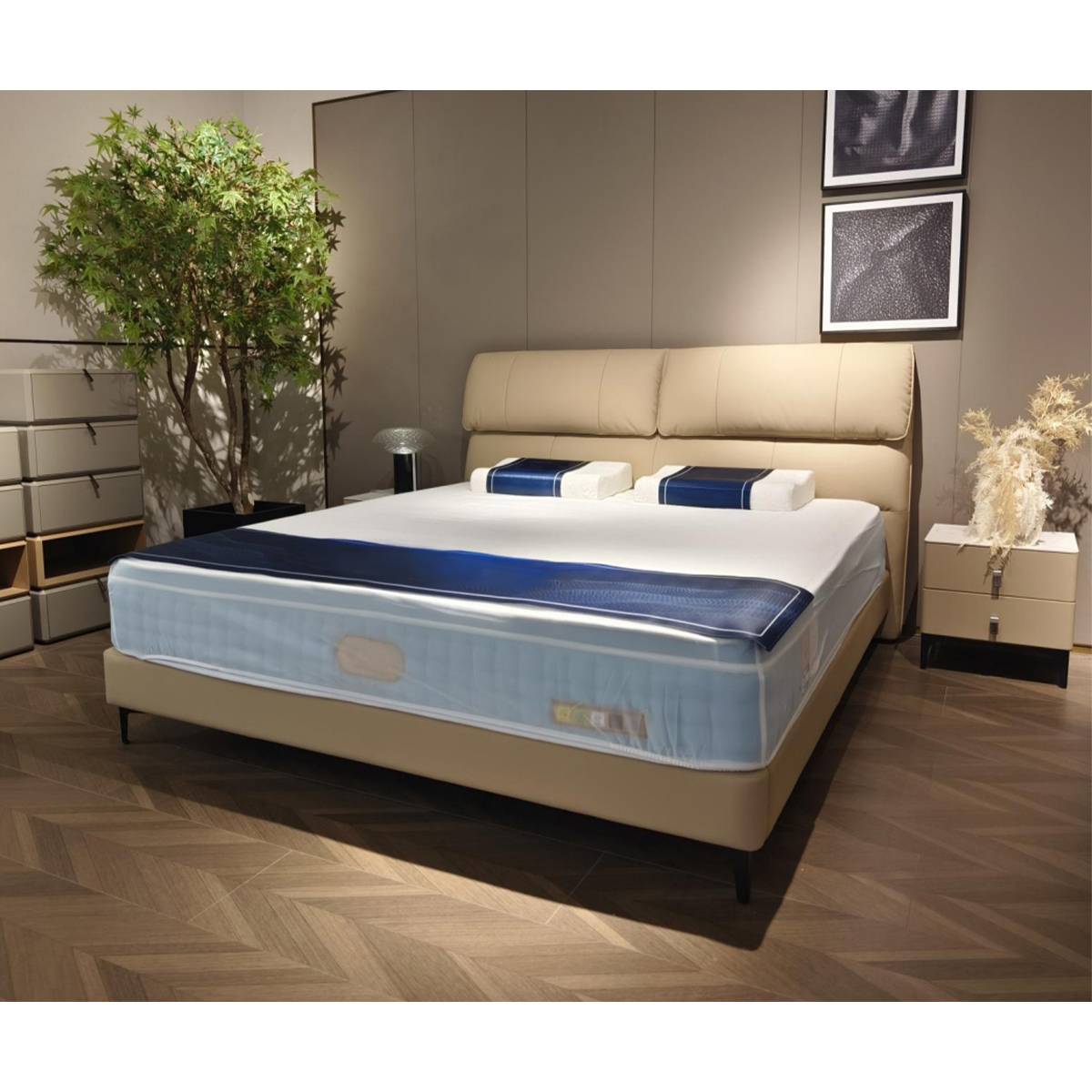 Full view of a beige upholstered bed with a blue and white mattress in a modern bedroom setting.