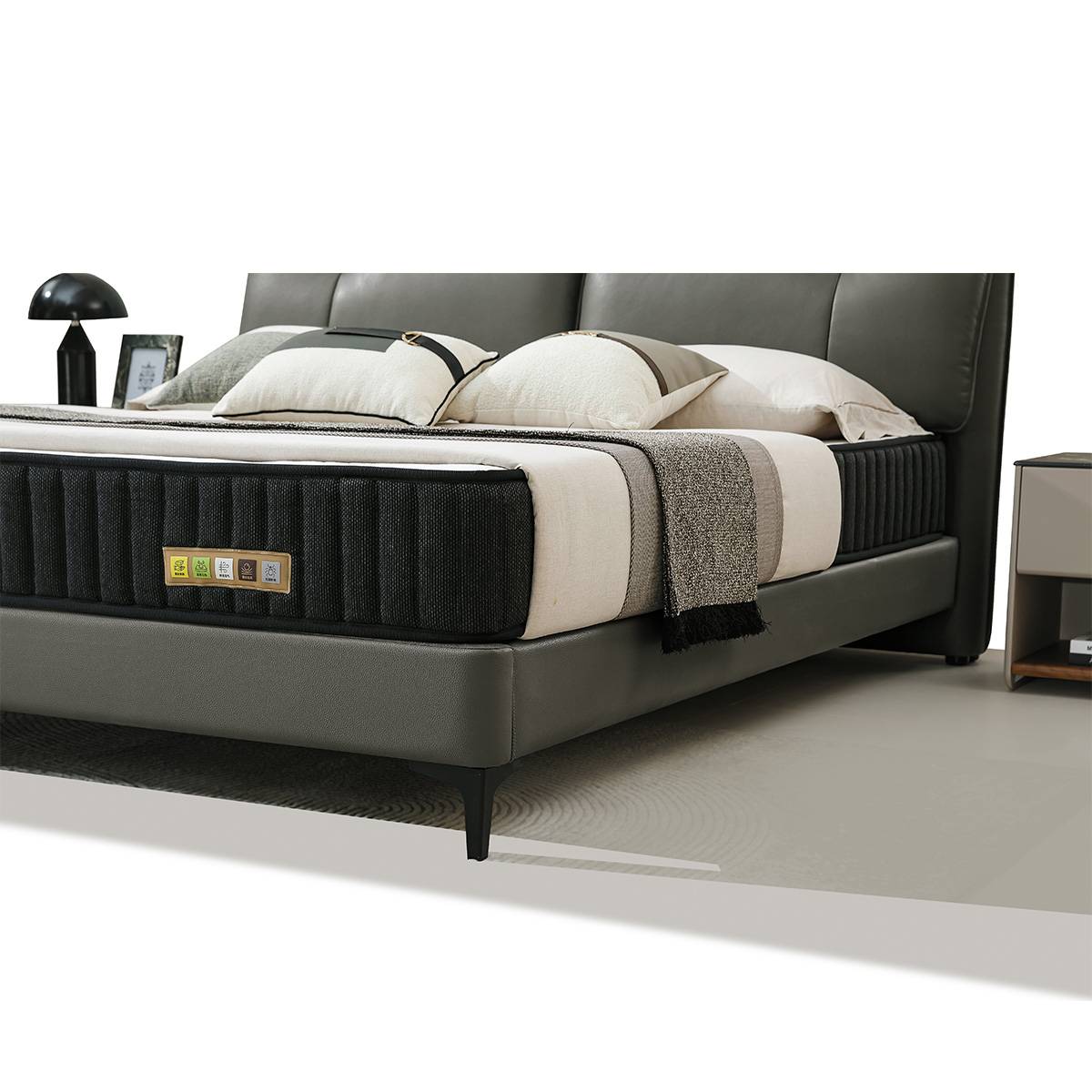 Close-up side view of the bed frame, mattress, and leg detail