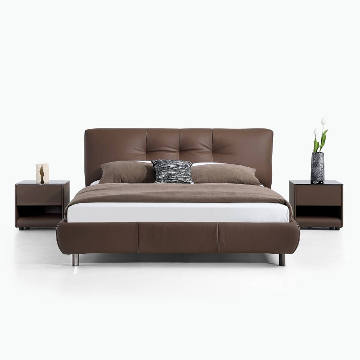 Front view of the brown leather bed showing the tufted headboard and bedding