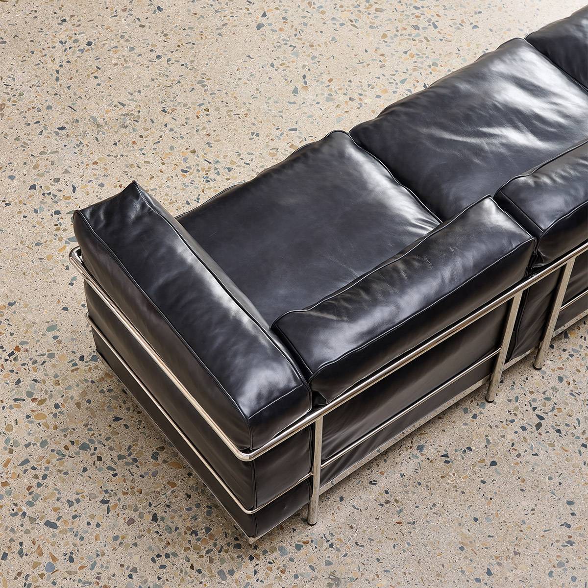 Close-up detail of the leather texture and metal frame corner